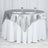 Silver satin tablecloth draped over a round table with glassware.