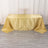 Gold striped tablecloth draped elegantly over a table.