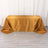 Gold striped tablecloth on a table, elegantly draped.