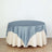 Round tablecloth with satin blue top and cream skirt on a plain background