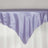 Lavender satin tablecloth draped elegantly over a table edge.