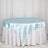 Blue satin tablecloth draped elegantly over a round table