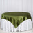 Green satin tablecloth draped over a white table skirt.