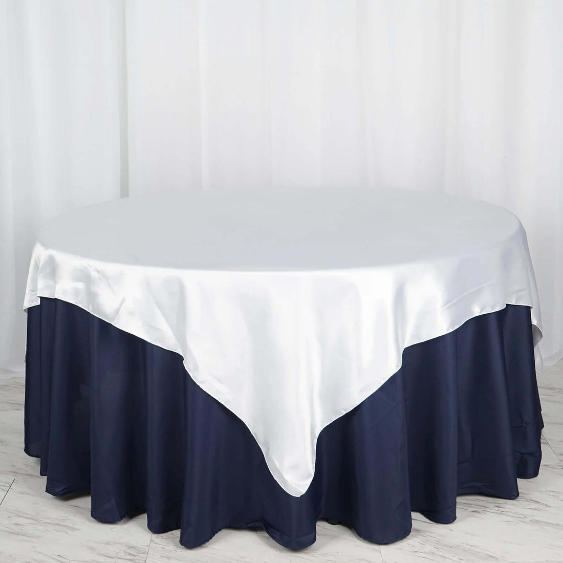 Round tablecloth with silver satin top and navy blue bottom