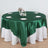 Round green satin tablecloth draped elegantly over a white table.
