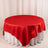 Red satin tablecloth draped over a round table.