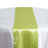 Green satin table runner on a white tablecloth #whtbkgd