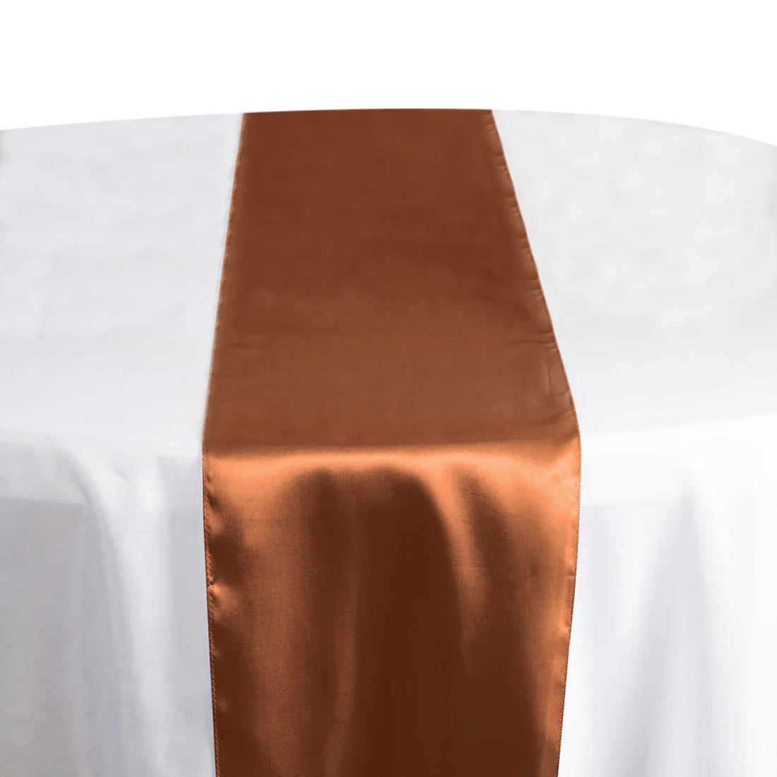 Copper satin table runner on a white tablecloth. #whtbkgd