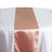 Rose gold satin table runner on a white tablecloth #whtbkgd