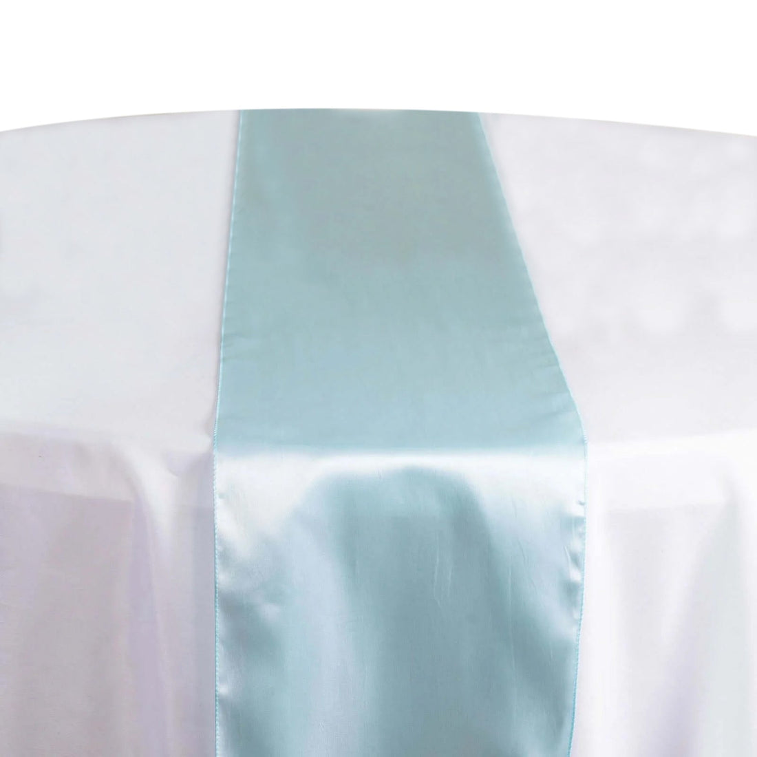 Light blue satin table runner on a white tablecloth #whtbkgd