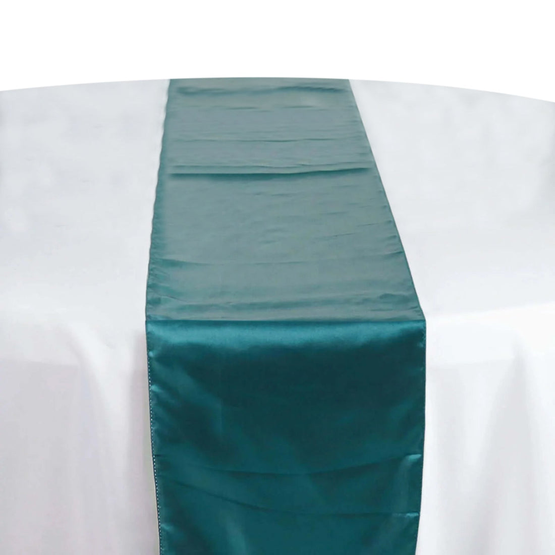 Teal satin table runner on a white tablecloth #whtbkgd
