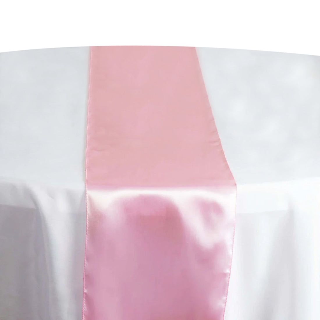 Pink satin table runner on a white tablecloth #whtbkgd