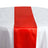 Red satin table runner on a white tablecloth. #whtbkgd