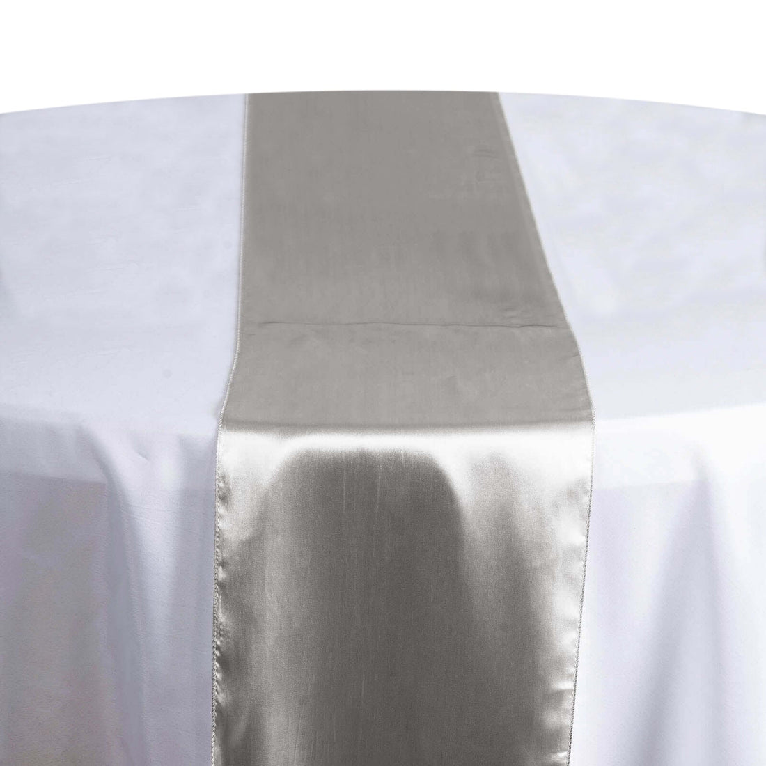 Silver satin table runner on a white tablecloth #whtbkgd