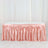 Pink satin table skirt with elegant draping.