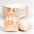 Set of satin drawstring bags in peach color, including one bag in front.