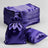 Purple satin drawstring bags stacked with one bag and cushion on the side.