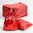 Red satin drawstring bags and flat pouches stacked together.