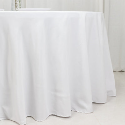 White tablecloth draping elegantly over a table surface.