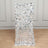 Silver sequin table skirt on a plain backdrop