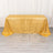 Gold tablecloth with shimmering texture on a plain backdrop.