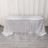 White table with a silver tablecloth draping elegantly.