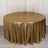 Gold shimmer tablecloth draping a round table in a studio setting.