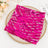 Fuchsia sequin table runner on a decorative plate