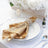 Gold sequin napkin elegantly styled on a plate with decorative table setting.