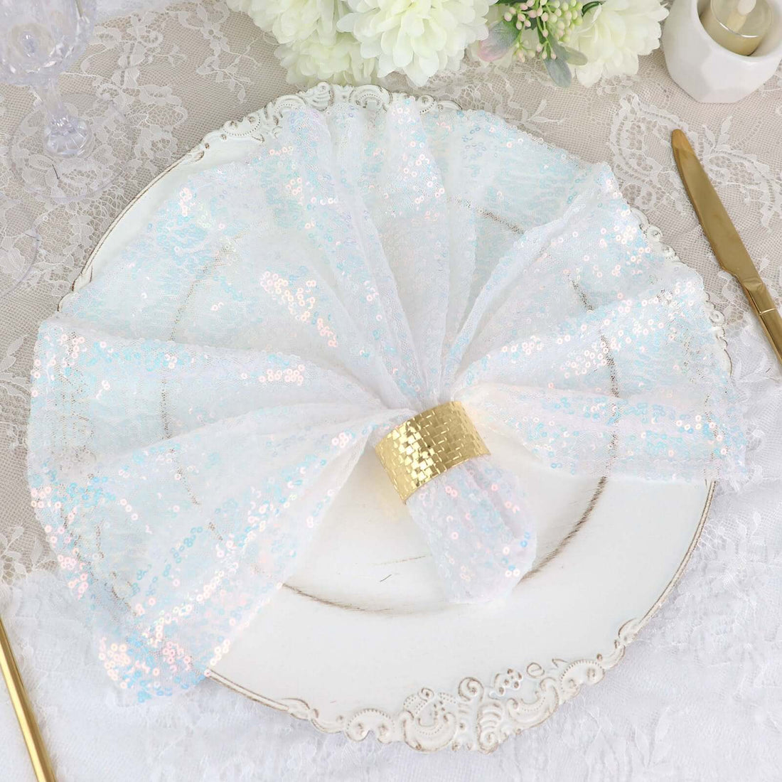 Iridescent sequin napkin elegantly arranged on a vintage plate.