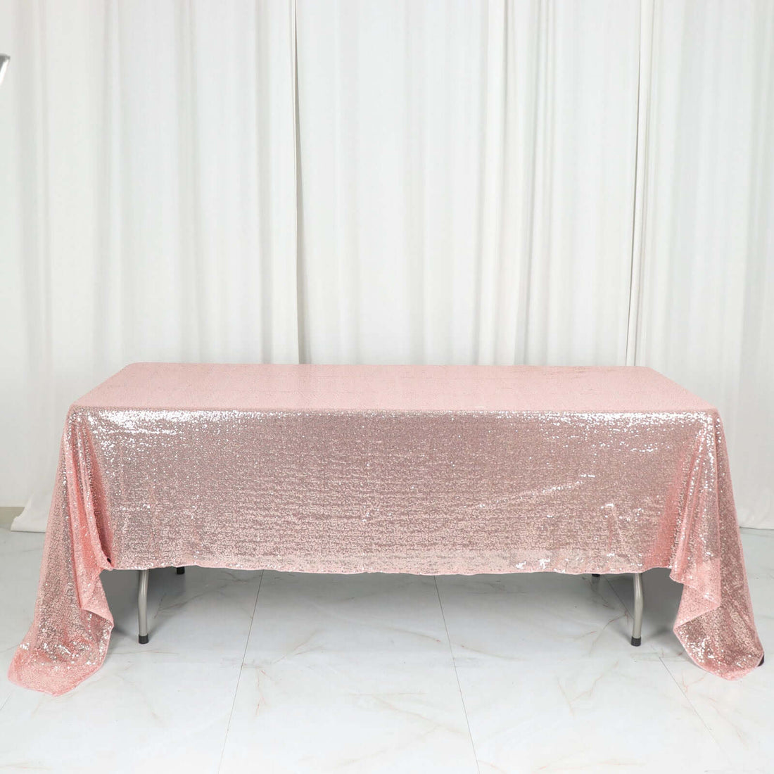 Pink sequin tablecloth draped elegantly over a table.