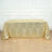 Gold geometric tablecloth with shimmering design on a table.