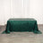 Green sequin tablecloth draped on a table with a plain backdrop.