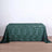 Green patterned tablecloth with geometric design on a plain background.