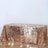 Rose gold sequin table cover on a plain backdrop.
