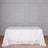 White tablecloth adorned with textured details on a plain backdrop.