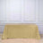 Gold sequin tablecloth draped over a table in a studio setting.