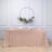 Rose gold sequin tablecloth draped over a table with floral decor.