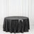 Black sequin tablecloth draped over a round table