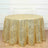 Gold geometric tablecloth on a round table in a bright setting.