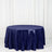 Navy sequin tablecloth on a round table against a white backdrop
