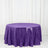 Purple sequin tablecloth on a round table against a white backdrop.
