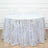 Silver sequin tablecloth with leaf pattern on a round table.