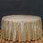 Gold sequin tablecloth draped over a round table.