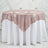 Rose gold sequin tablecloth draped elegantly over a white table.