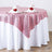 Pink sequin tablecloth elegantly draped on a round table with napkin decor.