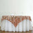 Rose gold sequin tablecloth draped elegantly over a white table.