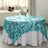 Turquoise sequin tablecloth draped elegantly on a round table setting.