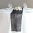 Black and white geometric table runner on a dining table with floral centerpiece.