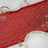 Red sequin table runner with gold accents on white table setting